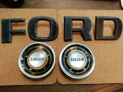 Ford Corsair steering wheel centres and large letters. Need refurb, see scans